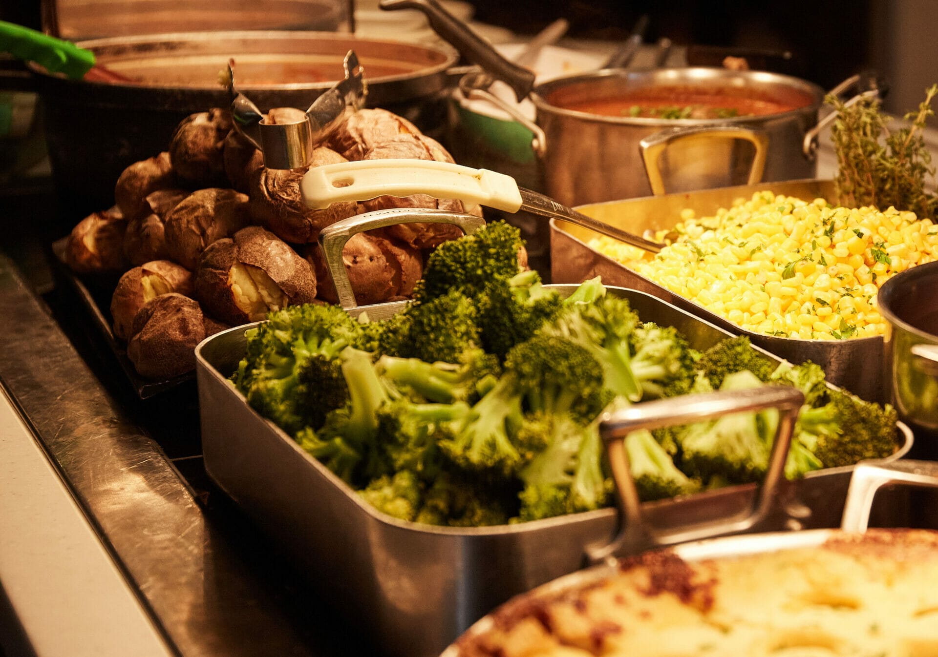 The food available for school lunches at The Blue Coat School including broccoli, jacket potatoes and rice.