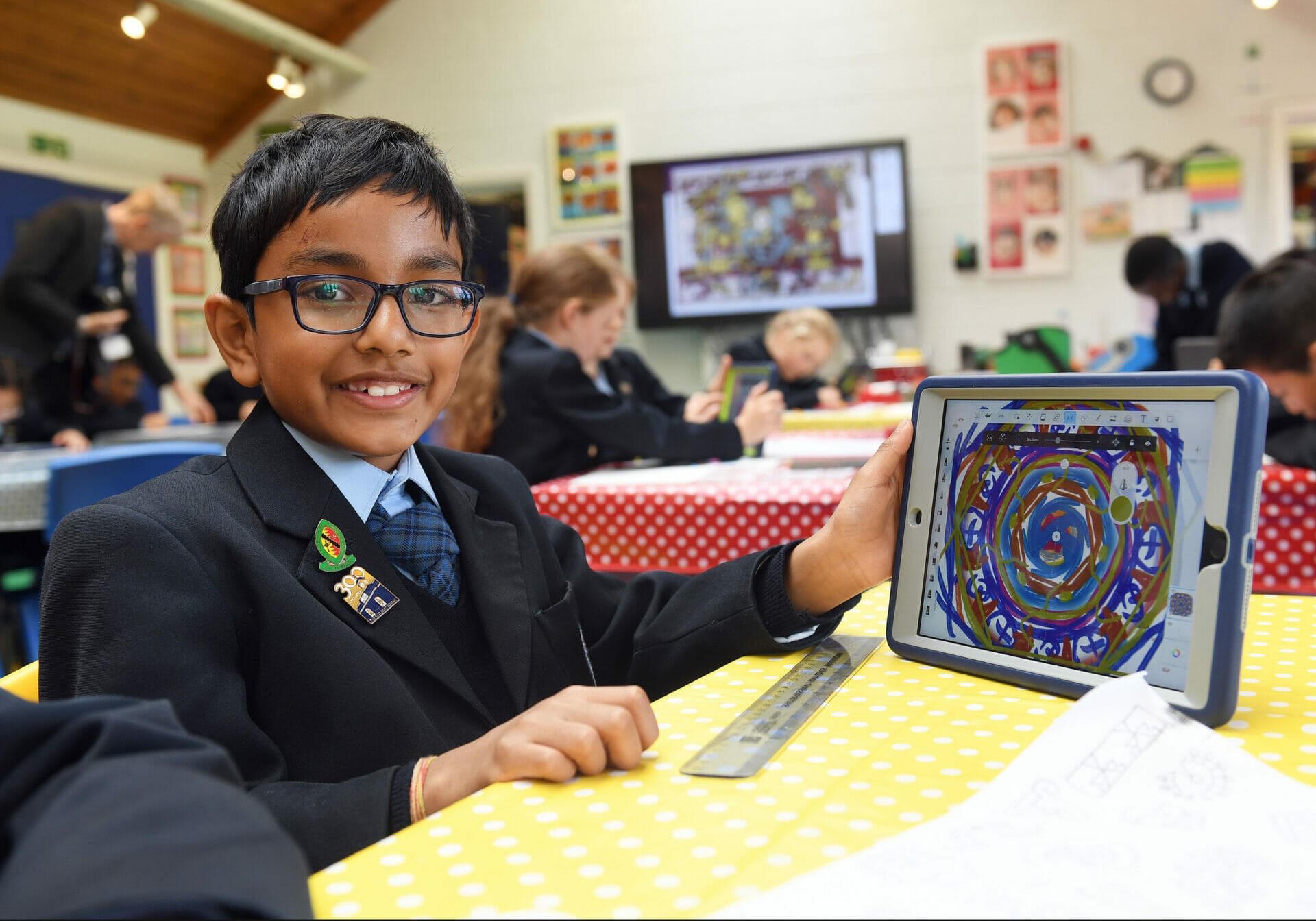 A pupil showing artwork they have completed in Creative Arts on their iPad.