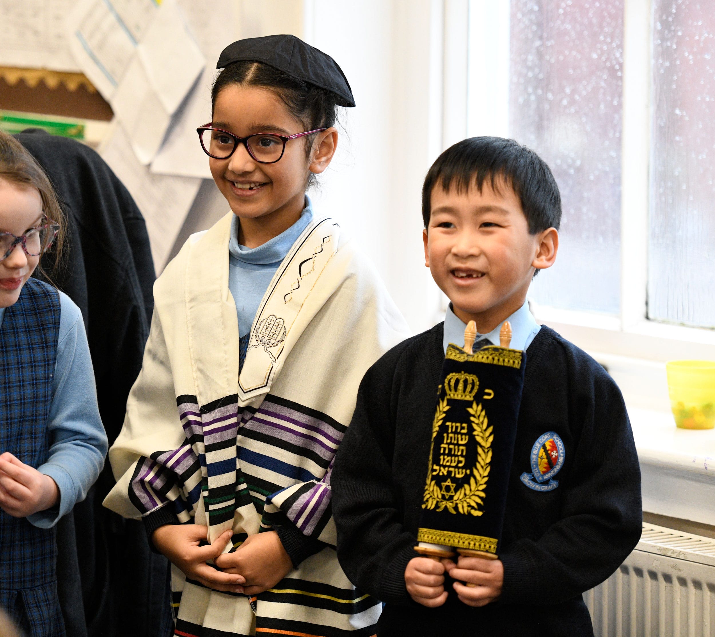 A girl and a boy in a Year 2 RE lesson.