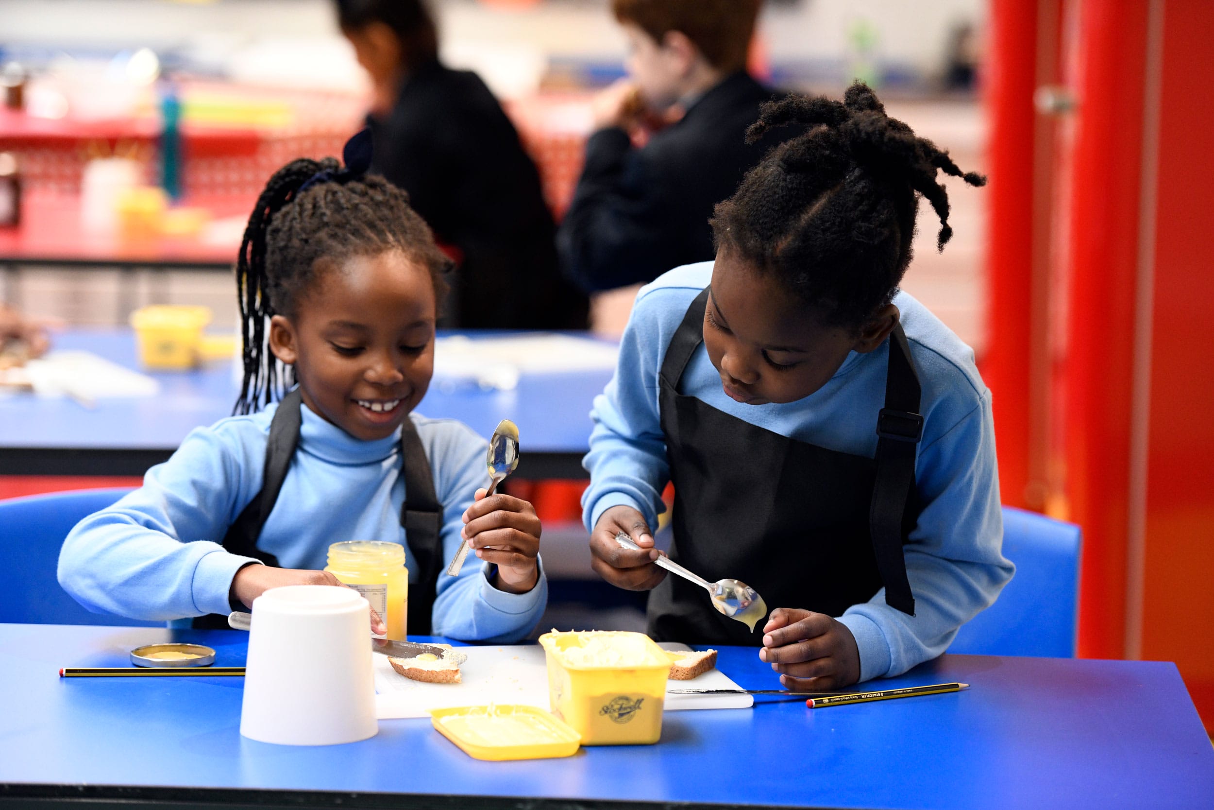 Two girls making sandwiches in a food technology at The Blue Coat School.