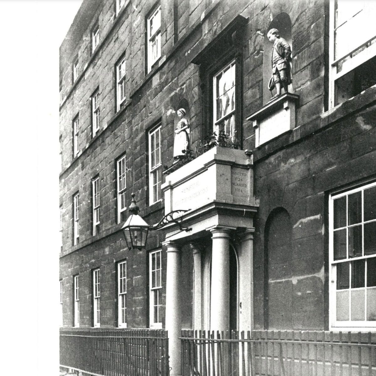 The Blue Coat Boy and Girl above the original School entrance in Colmore Row