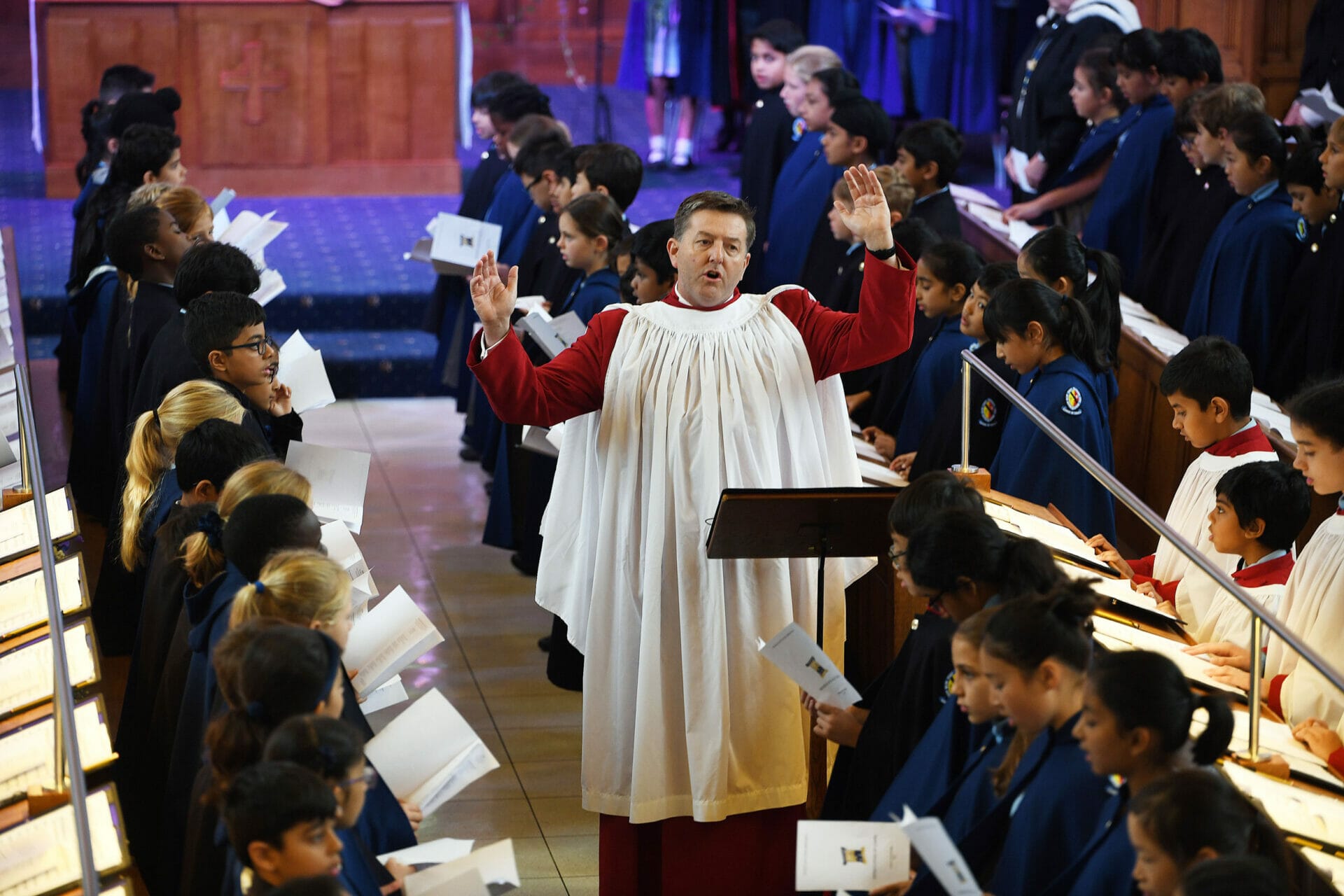 Mr Nicklin, Director of Music at The Blue Coat School conducts the Chapel Choir during a Chapel Service.