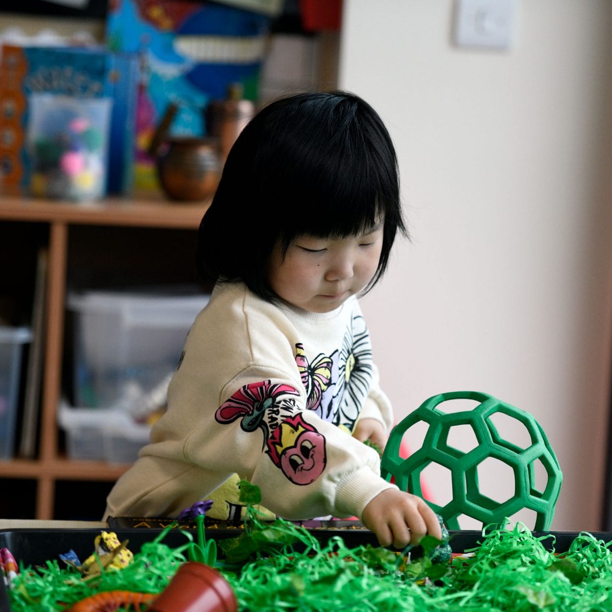 A girl playing with toys at The Blue Coat School's Stay and Play admissions event.