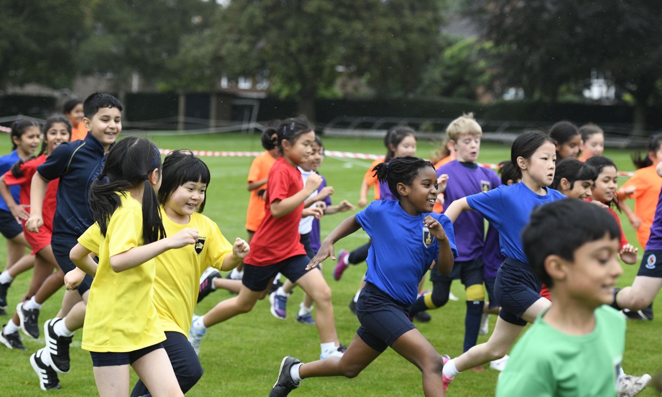 A colourful display of House T-shirts as the children begin their Harrison Mile