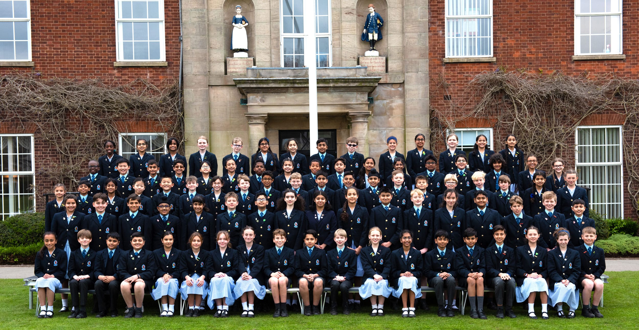 The Year 6 Class of 2023 sat in front of The Blue Coat School